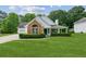 Charming single-Gathering home with a well-manicured lawn and beautiful landscaping at 3935 Hamilton View Way, Dacula, GA 30019
