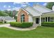 Charming single-story home featuring a brick accent, manicured bushes, and a well-kept front yard at 3935 Hamilton View Way, Dacula, GA 30019
