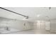 Spacious garage featuring ample shelving and storage options for organization and functionality at 3935 Hamilton View Way, Dacula, GA 30019
