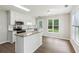 Bright kitchen with an island, stainless appliances, and granite countertops at 3935 Hamilton View Way, Dacula, GA 30019