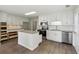 Bright kitchen featuring white cabinets, stainless steel appliances and granite countertops at 3935 Hamilton View Way, Dacula, GA 30019