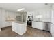 Charming kitchen with island, stainless appliances, and ample cabinetry at 3935 Hamilton View Way, Dacula, GA 30019
