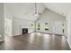Bright living room featuring a fireplace, ceiling fan, and wood-look flooring at 3935 Hamilton View Way, Dacula, GA 30019