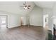 Spacious living room with a fireplace and wood-look flooring at 3935 Hamilton View Way, Dacula, GA 30019