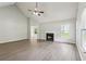 Open living room boasts vaulted ceilings and a cozy fireplace at 3935 Hamilton View Way, Dacula, GA 30019