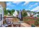Outdoor deck with wooden railing and furniture offers a relaxing space to enjoy the backyard at 1740 Ambercrest Pl, Buford, GA 30518