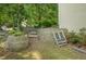 Backyard features a retaining wall and steps with a small storage area at 1740 Ambercrest Pl, Buford, GA 30518