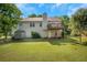 Expansive backyard featuring a deck, shed, and lush lawn, ideal for recreation and relaxation at 1740 Ambercrest Pl, Buford, GA 30518