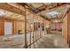 Unfinished basement with exposed beams and a concrete floor presents renovation opportunities at 1740 Ambercrest Pl, Buford, GA 30518