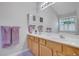 Bathroom featuring a double vanity with white countertop, cabinets, and neutral walls at 1740 Ambercrest Pl, Buford, GA 30518