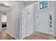 Bright entryway with soaring ceilings, light walls, hardwood floors and transom window at 1740 Ambercrest Pl, Buford, GA 30518