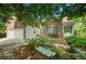Charming brick home with green shutters, landscaped yard and stone path with bench at 1740 Ambercrest Pl, Buford, GA 30518