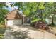 Charming brick home with a two-car garage, green shutters and a landscaped yard at 1740 Ambercrest Pl, Buford, GA 30518