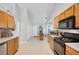 Bright kitchen featuring modern stainless steel appliances and ample counter space at 1740 Ambercrest Pl, Buford, GA 30518
