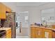 Well-lit kitchen featuring stainless steel appliances and view to dining area at 1740 Ambercrest Pl, Buford, GA 30518