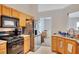 Kitchen with view to dining area and stainless steel appliances at 1740 Ambercrest Pl, Buford, GA 30518