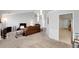 Spacious open-concept living room with stylish furniture, modern lighting, and seamless flow at 1740 Ambercrest Pl, Buford, GA 30518
