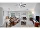 Spacious living room with fireplace, plush carpeting, ceiling fan and lots of windows at 1740 Ambercrest Pl, Buford, GA 30518