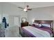 Light and airy main bedroom with a ceiling fan, neutral walls, and carpeted floors at 1740 Ambercrest Pl, Buford, GA 30518