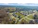 Wide aerial view showcasing the neighborhood's layout and proximity to green spaces and natural landscapes at 205 Carrington Pt, Canton, GA 30115