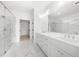 Bright and spacious bathroom with marble floors, glass shower, and a double sink vanity at 205 Carrington Pt, Canton, GA 30115