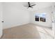 Bedroom featuring neutral carpet, ceiling fan, and view to outside at 205 Carrington Pt, Canton, GA 30115