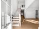Bright and airy foyer with hardwood floors, a staircase, and modern finishes throughout at 205 Carrington Pt, Canton, GA 30115