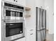 Stainless steel kitchen appliances include a built-in oven and a refrigerator at 205 Carrington Pt, Canton, GA 30115