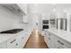 Large kitchen showcases white cabinets, quartz countertops, and stainless steel appliances at 205 Carrington Pt, Canton, GA 30115