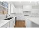 Elegant kitchen features granite counters, stainless steel appliances, and ample counter space at 205 Carrington Pt, Canton, GA 30115