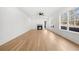 Living room featuring a fireplace, ceiling fan, and large windows for natural light at 205 Carrington Pt, Canton, GA 30115