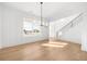 Bright, spacious living room featuring an open floor plan, hardwood floors and natural light at 205 Carrington Pt, Canton, GA 30115