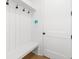 Mudroom with seating and coat hooks near the entrance door at 205 Carrington Pt, Canton, GA 30115