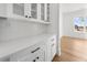 Pantry with white cabinets and drawers, a white countertop, and subway tile backsplash at 205 Carrington Pt, Canton, GA 30115
