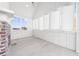 Bright sunroom with white walls, a fireplace and shuttered windows at 205 Carrington Pt, Canton, GA 30115