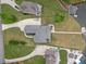 Aerial view showcases landscaped property leading to a waterfront home at 2191 Lakeview Pkwy, Villa Rica, GA 30180