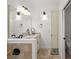Bathroom featuring a granite vanity, large mirror and built-in linen closet at 2191 Lakeview Pkwy, Villa Rica, GA 30180