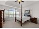 Spacious main bedroom with tray ceilings and a window overlooking the backyard at 2191 Lakeview Pkwy, Villa Rica, GA 30180