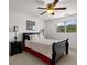 Bedroom featuring a ceiling fan, comfortable bed, and an ample amount of natural light at 2191 Lakeview Pkwy, Villa Rica, GA 30180