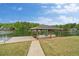 Lakefront boat dock equipped with boat and shelter, set against a backdrop of lush greenery at 2191 Lakeview Pkwy, Villa Rica, GA 30180