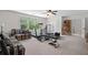 Bonus room with a ceiling fan, comfortable seating, and home gym equipment at 2191 Lakeview Pkwy, Villa Rica, GA 30180
