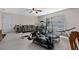 Bonus room with home gym equipment, comfortable seating, and a ceiling fan at 2191 Lakeview Pkwy, Villa Rica, GA 30180