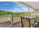 A covered deck offers a cozy seating area with scenic lake views at 2191 Lakeview Pkwy, Villa Rica, GA 30180