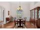 Formal dining room features hardwood floors and classic chandelier at 2191 Lakeview Pkwy, Villa Rica, GA 30180