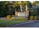 Stone sign for Fairfield Plantation surrounded by greenery and colorful flowers at 2191 Lakeview Pkwy, Villa Rica, GA 30180