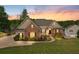 Charming brick and siding home with lush lawn and manicured landscaping and convenient side-entry garage at 2191 Lakeview Pkwy, Villa Rica, GA 30180