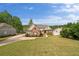 Charming brick and siding home with lush lawn and manicured landscaping and convenient side-entry garage at 2191 Lakeview Pkwy, Villa Rica, GA 30180