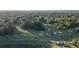 Scenic aerial view of a well-maintained golf course surrounded by lush forest, featuring sand traps and winding paths at 2191 Lakeview Pkwy, Villa Rica, GA 30180