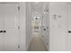 Long hallway lined with multiple white doors and neutral carpet at 2191 Lakeview Pkwy, Villa Rica, GA 30180