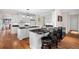 Kitchen features white cabinets, black granite countertops and barstool seating at 2191 Lakeview Pkwy, Villa Rica, GA 30180